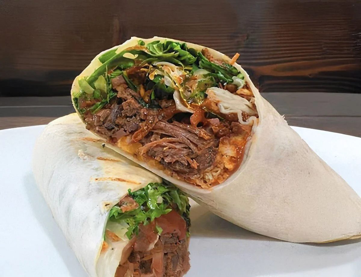 Loaded burrito cut open to show its filling